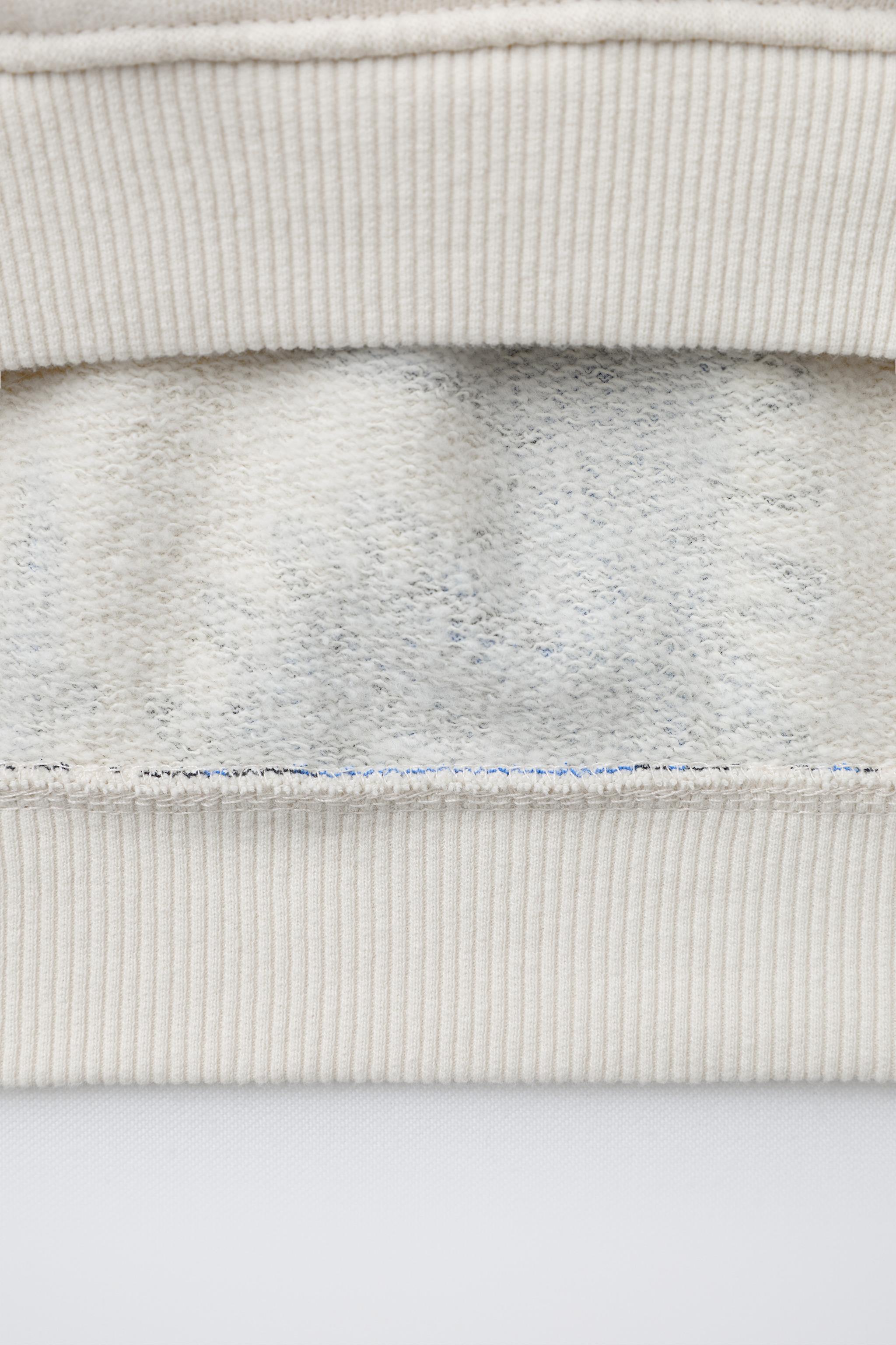 DINOSAUR PRINT SWEATSHIRT